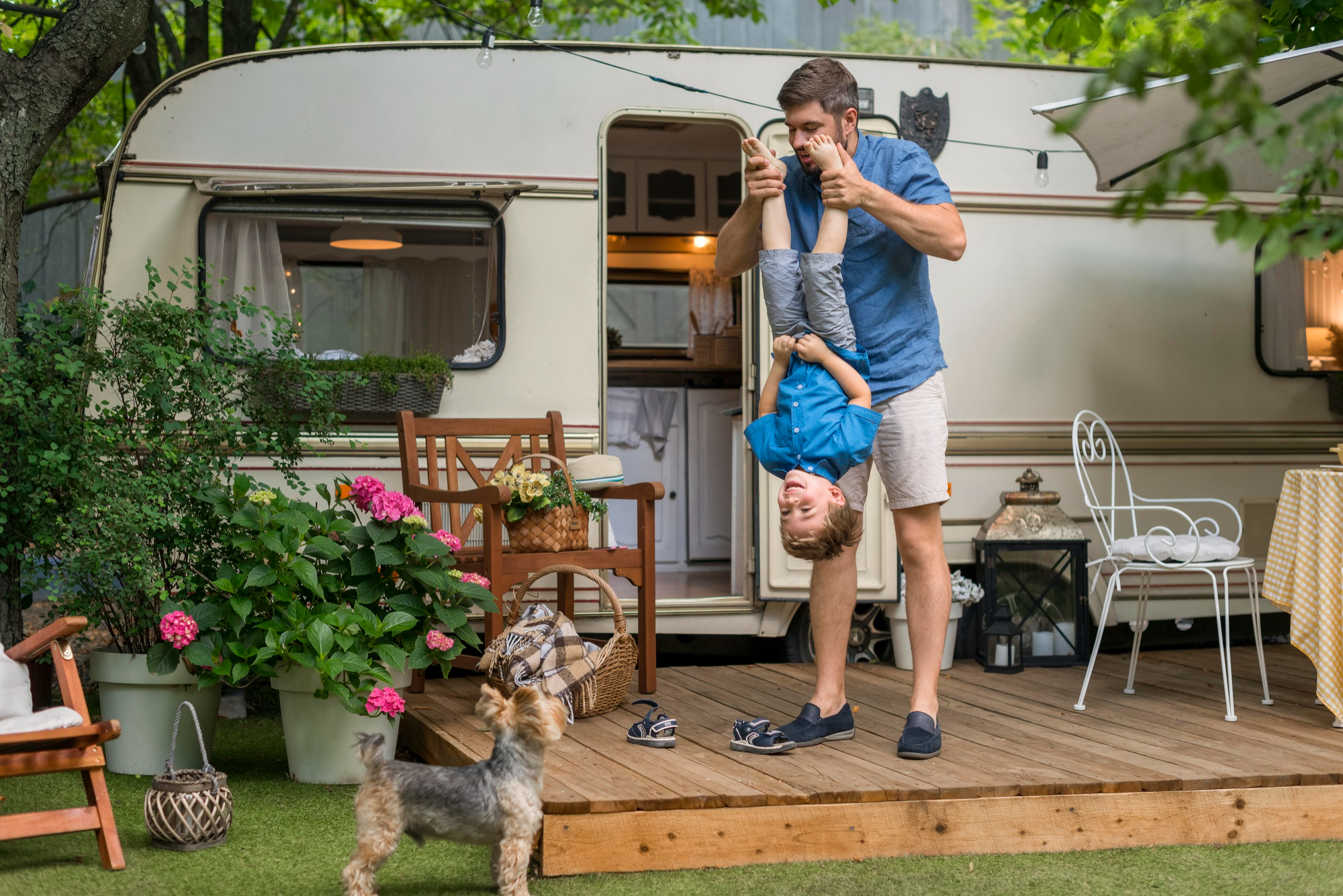 Father playing with his kids in a mobile home park, symbolizing Clopton Capital’s mobile home park financing services.